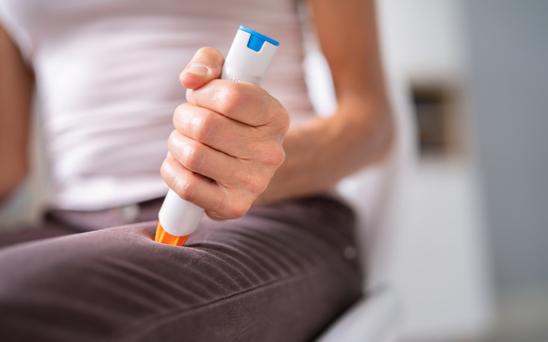 mother assisting child with inhaler for respiratory treatment at home
